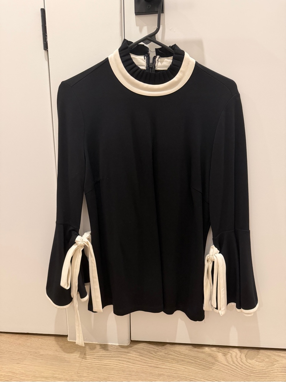 Black Long-Sleeve Top with Cream Trim and Tie Detail